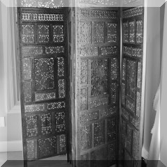 F18. Carved teak screen. 6'h - $375